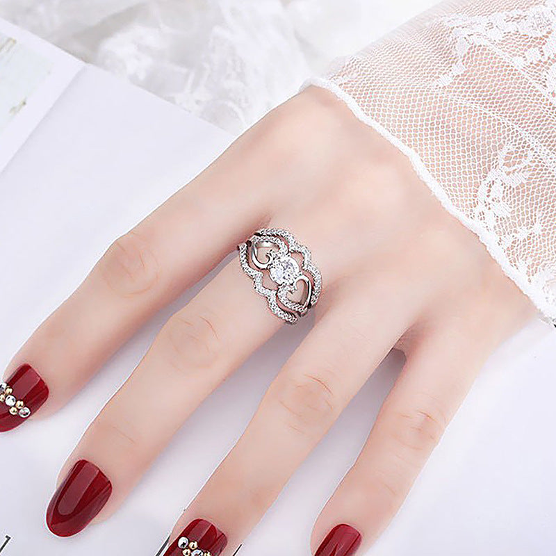 Damenring mit kunstvollem Zirkonia-Besatz und elegantem Wellenmuster Shop Nory