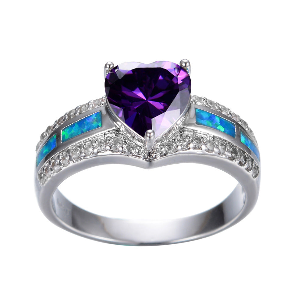 Damen Ring mit herzförmigem smaragdgrünem Stein und feinen Zirkonia-Details Shop Nory