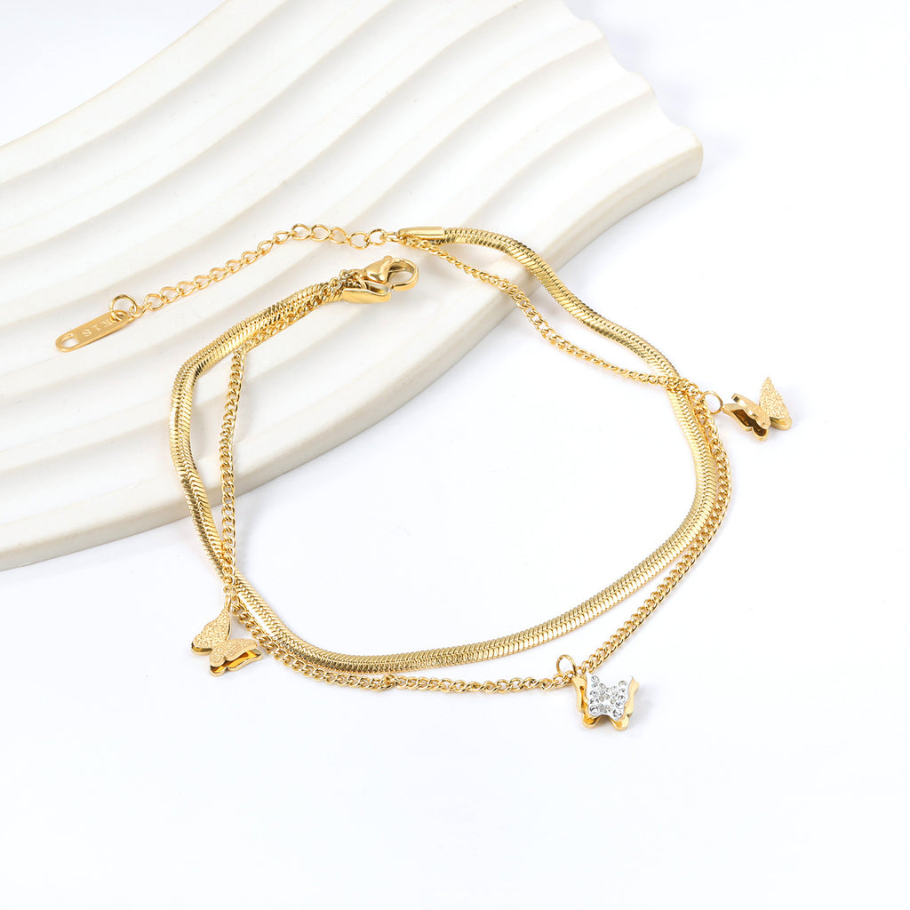 Damen Armband mit zarten Schmetterlingsanhängern und goldplattierter Oberfläche Shop Nory