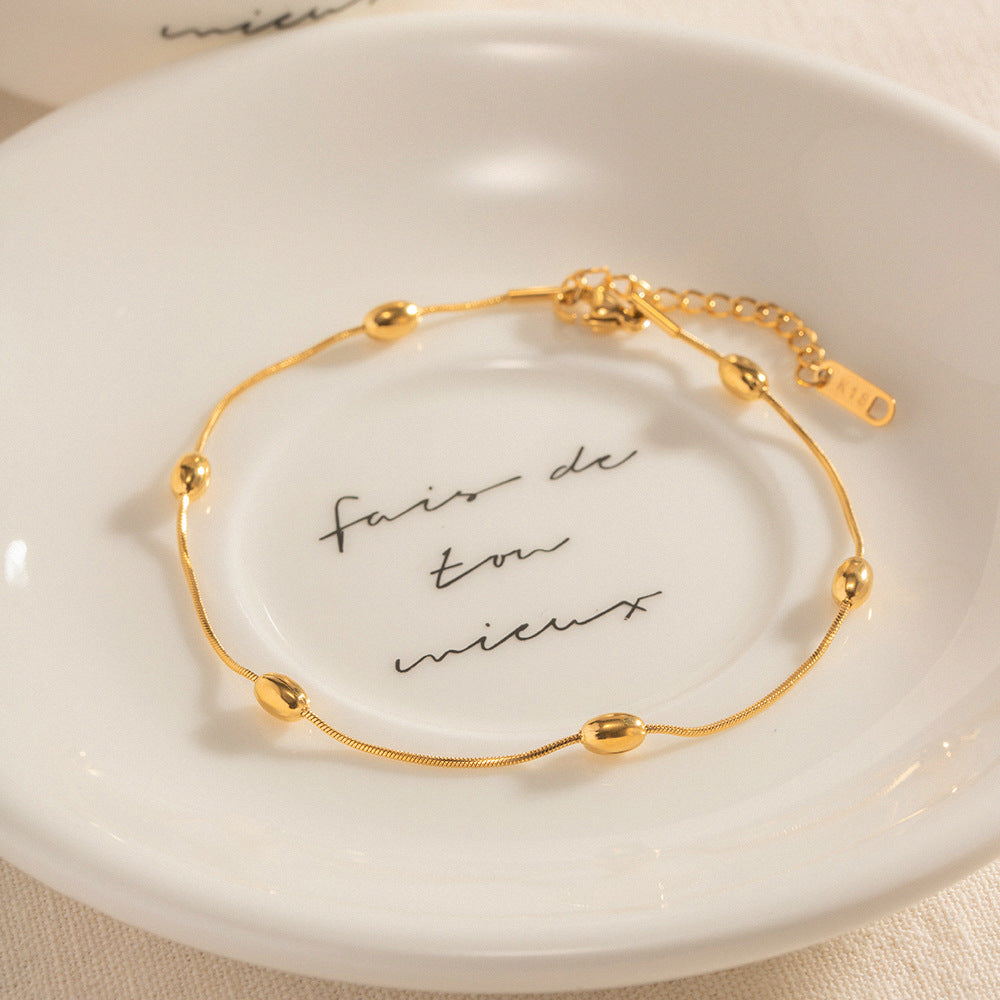 Damen Edelstahl-Armband mit goldfarbener Kugelverzierung und verstellbarem Verschluss Shop Nory
