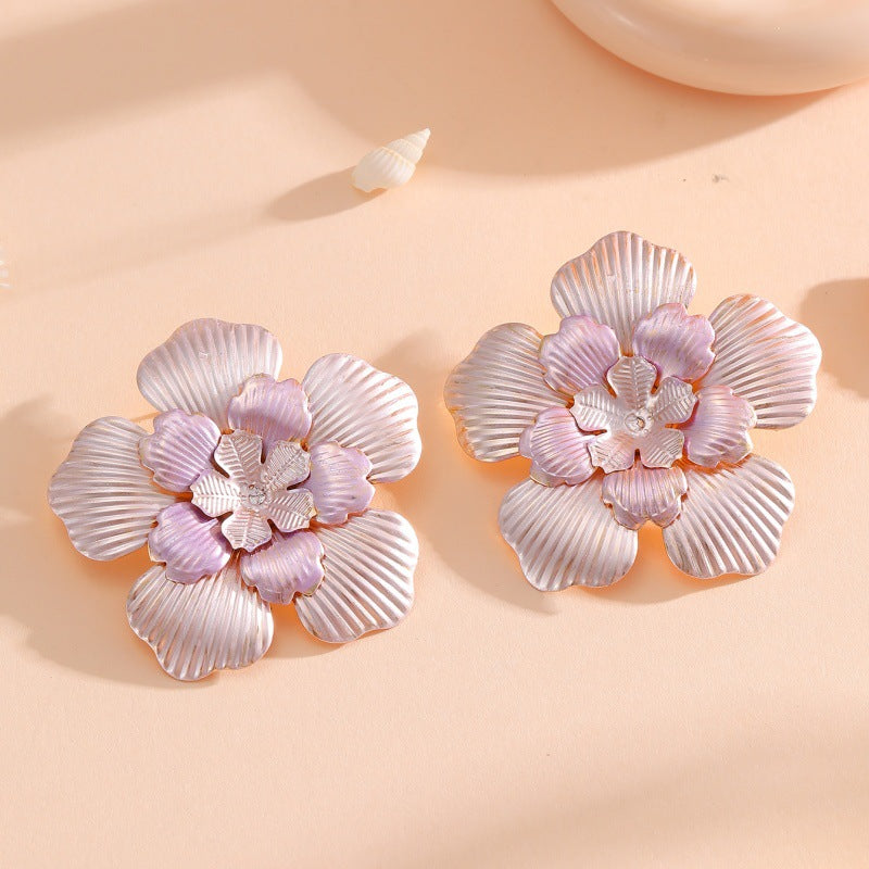 Damen Blumenohrringe mit filigranem Design und glänzenden Akzenten Shop Nory