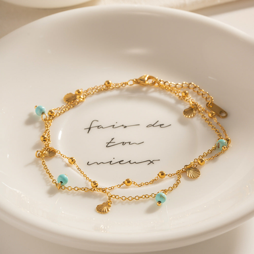 Damen elegantes Armband mit Muschel- und Quarz-Details Shop Nory