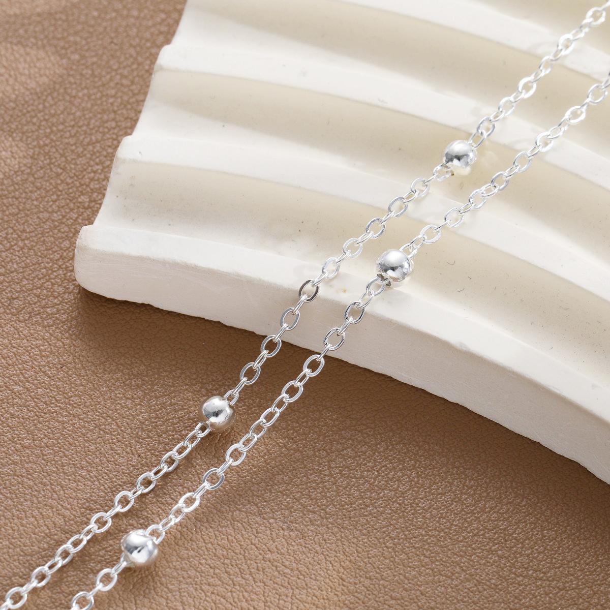 Damenarmband mit modischem Doppelketten-Design und eleganten Metallakzenten Shop Nory