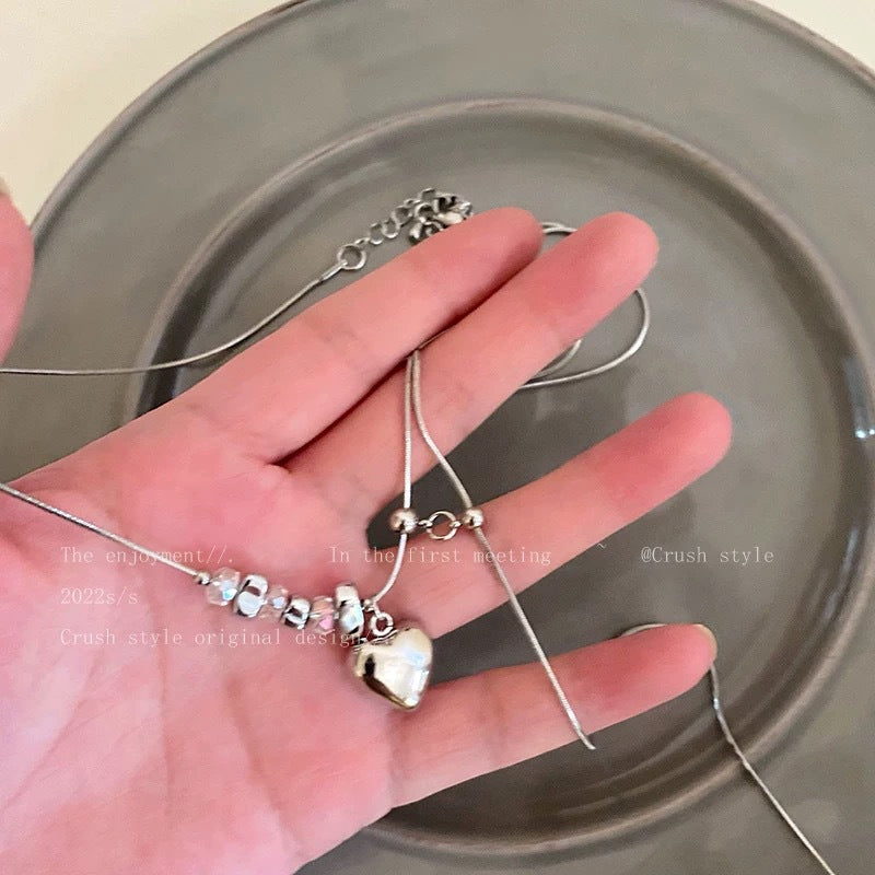 Damen Halskette mit glänzendem Herzanhänger und edlen Kristallelementen Shop Nory