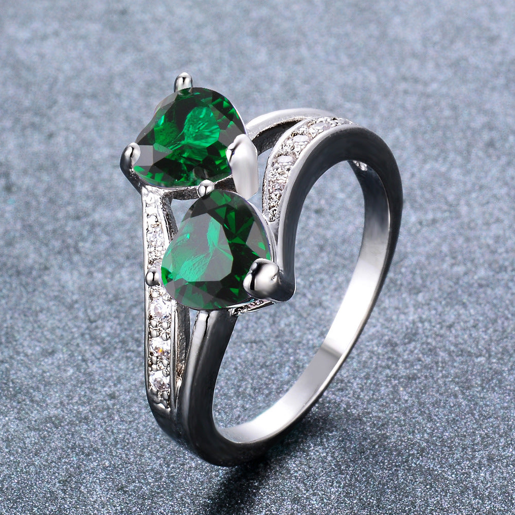 Damen Ring mit zwei herzförmigen blauen Zirkonen und funkelnden Zirkonia-Details Shop Nory