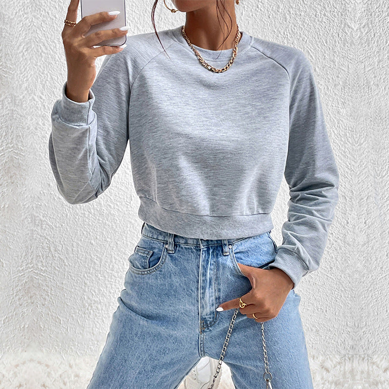 Damen Kurzes minimalistisches Sweatshirt mit Raglanärmeln und geripptem Saum Shop Nory
