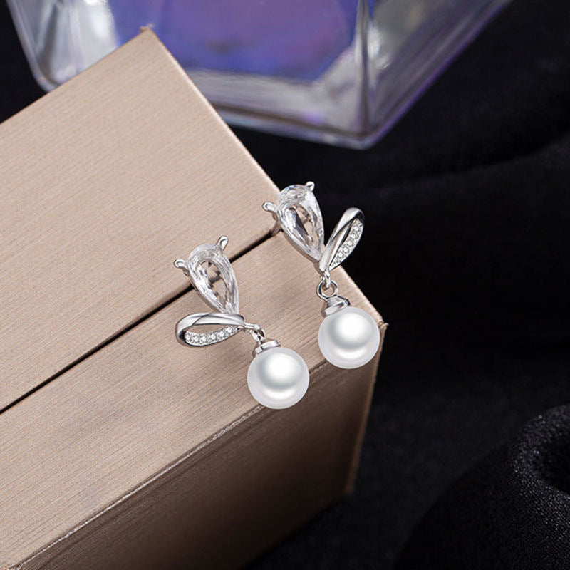 Damen Ohrstecker mit eleganten Perlen und funkelnden Zirkonia von Shop Nory