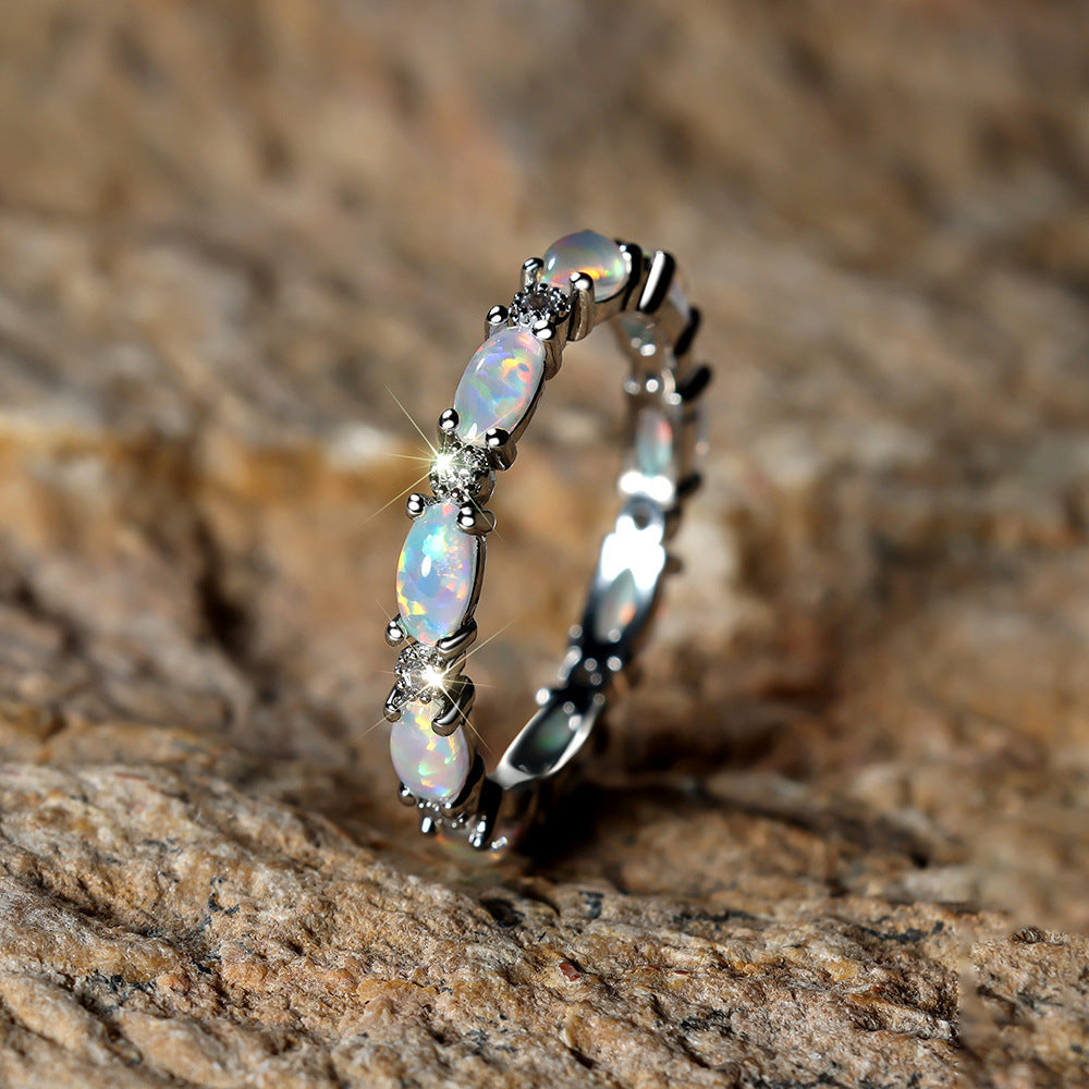 Damen Ring mit funkelnden Opalsteinen und filigranem Design Shop Nory