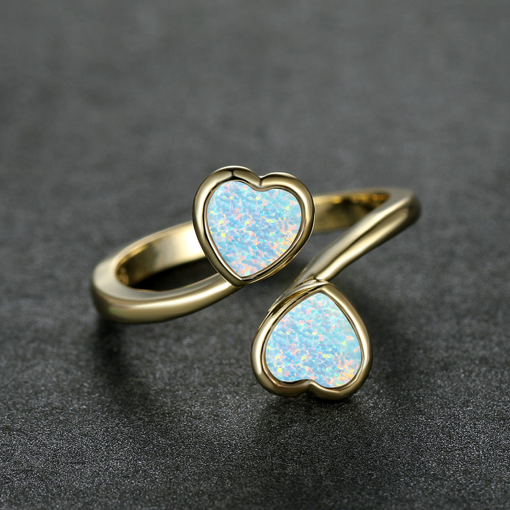 Damen Ring mit strahlendem Herzdesign und leuchtenden Opal-Effekten Shop Nory