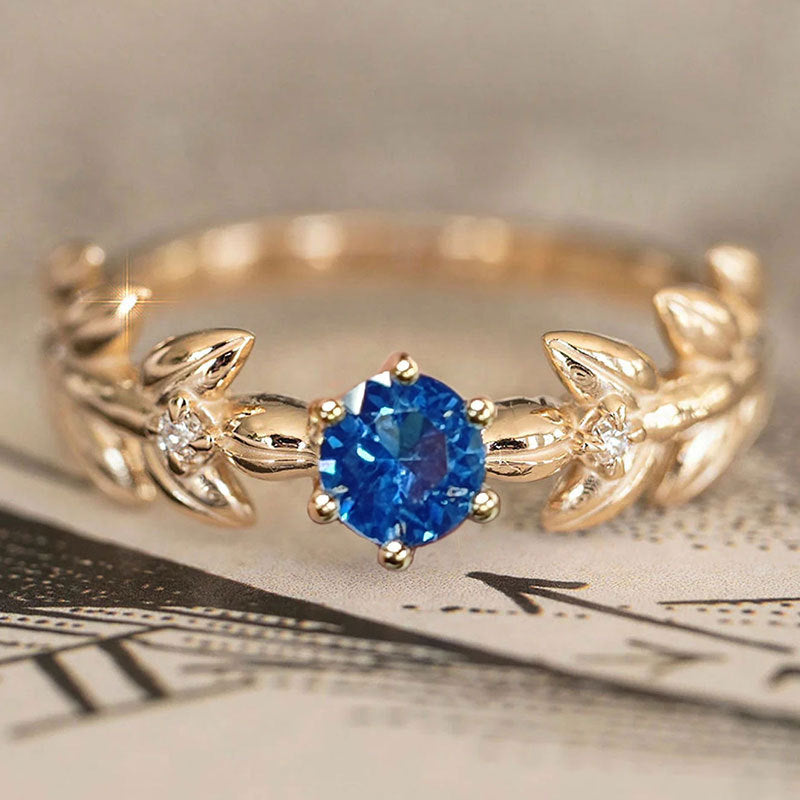 Damen Eleganter Verlobungsring mit blauem Stein und Blattdesign Shop Nory