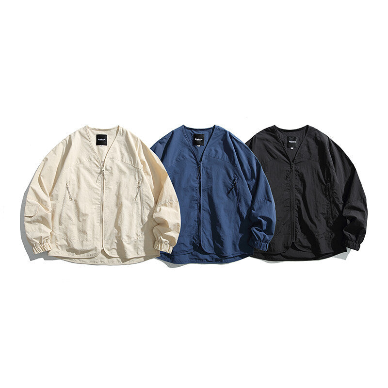Unisex Leichte Oversize‑Überhemdjacke aus technischem Nylonmix mit V‑Ausschnitt und Reißverschlusstaschen Shop Nory