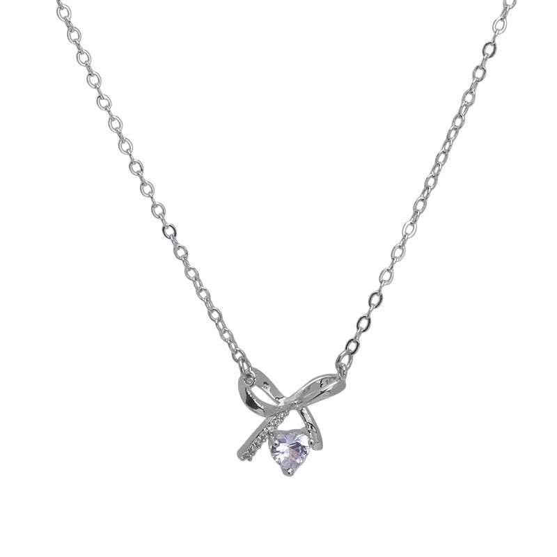 Damen Halskette mit elegantem Schleifenanhänger und funkelndem Kristall Shop Nory