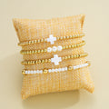 Damen Armband-Set mit eleganten Perlen- und Kreuzdetails Shop Nory