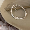 Damen Armband mit handgefertigtem Katzenanhänger und edlen Perlen Shop Nory
