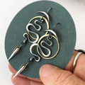 Große Silberne Gothic Schlangen Kreis Creolen | Shop Nory