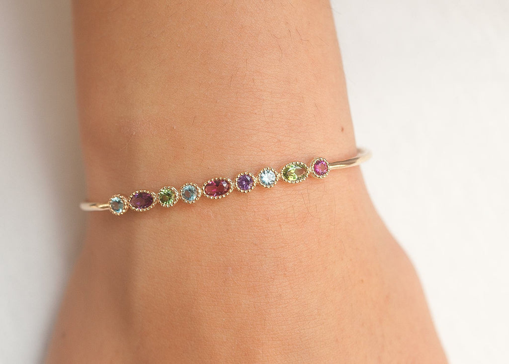 Armreifen mit bunten Glitzersteinen vergoldet | Shop Nory
