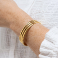 Gold-colored bracelet made of stainless steel – Three-row, adjustable women's bracelet | Shop Nory