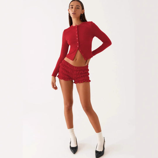 Einfarbige schmal geschnittene lange Strickjacke