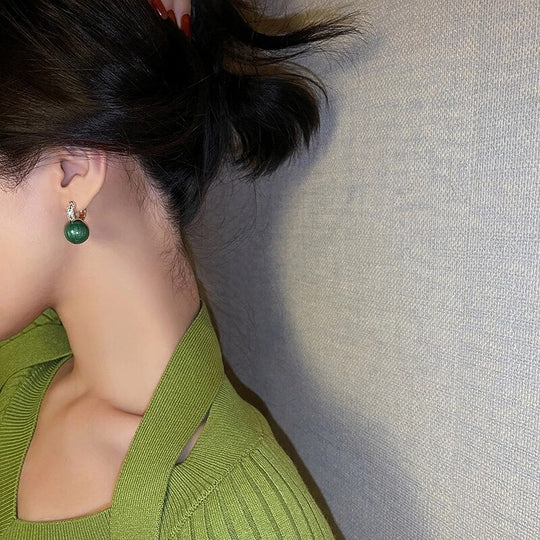 Elegante Luxusohrringe mit grünen Perlen | Shop Nory