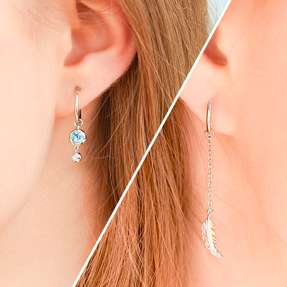 Federmondstein | Sterling Silber asymmetrische Feder Ohrringe, weißer Mondstein | Shop Nory