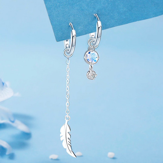 Federmondstein | Sterling Silber asymmetrische Feder Ohrringe, weißer Mondstein | Shop Nory