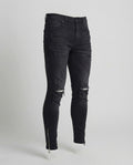 Herren Skinny Jeans mit Rissen & Saumreißverschluss