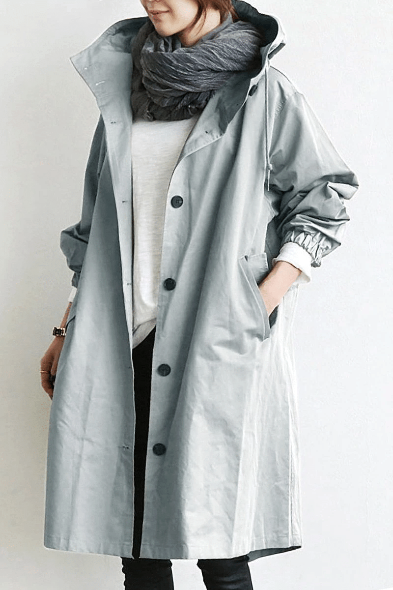 Die Windjacke mit Knöpfen und Kapuze für Damen