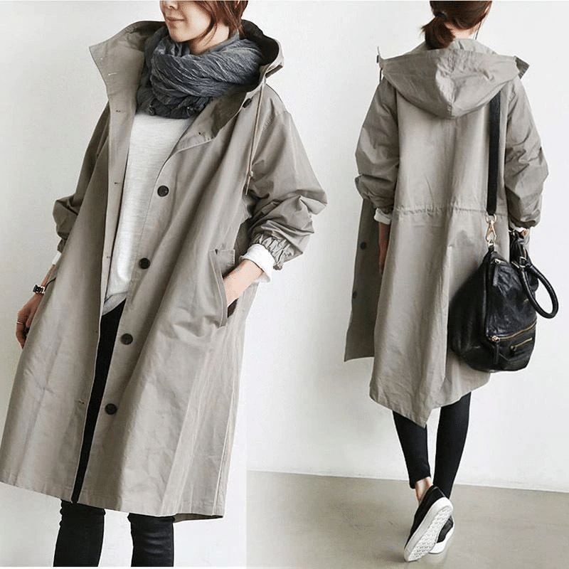 Die Windjacke mit Knöpfen und Kapuze für Damen